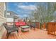 A spacious wood deck featuring seating arrangements and beautiful views of the backyard at 2889 Grimes Way, Columbus, IN 47201