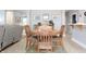 Dining area highlighting a table with four chairs, adjacent to the living room and kitchen at 2889 Grimes Way, Columbus, IN 47201