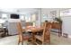 Cozy dining area featuring a round wooden table and seating for four, next to living room at 2889 Grimes Way, Columbus, IN 47201