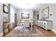 Elegant dining room featuring a classic chandelier, stylish rug, and abundant natural light at 2889 Grimes Way, Columbus, IN 47201