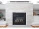 Close up of the stone fireplace with white shelves on either side at 2889 Grimes Way, Columbus, IN 47201