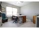Bright hobby room featuring a large window, neutral paint, and chair with crafting desk at 2889 Grimes Way, Columbus, IN 47201