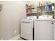 Convenient laundry room with modern appliances and ample shelving at 2889 Grimes Way, Columbus, IN 47201