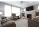 Inviting living room with large windows, a modern fireplace, and comfortable seating arrangement at 2889 Grimes Way, Columbus, IN 47201