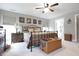 Well-lit main bedroom with wrought iron bed frame, neutral colors, and a cozy ambiance at 2889 Grimes Way, Columbus, IN 47201