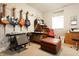 Music room with guitars, keyboard, desk, and natural light at 2889 Grimes Way, Columbus, IN 47201