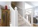 Bright, carpeted staircase with white railings, providing access to the upper level at 2889 Grimes Way, Columbus, IN 47201