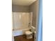 Bathroom with a combined tub and shower and toilet next to it at 2968 N Gale St, Indianapolis, IN 46218