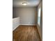 Bright room with hardwood flooring, window with blind, and fresh paint at 2968 N Gale St, Indianapolis, IN 46218