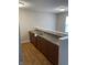 Functional kitchen featuring brown cabinets, laminate countertops, and stainless steel sink at 2968 N Gale St, Indianapolis, IN 46218