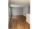 Open living area featuring wood floors, freshly painted walls, and natural light at 2968 N Gale St, Indianapolis, IN 46218