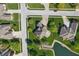 A bird's eye view captures the home's setting among beautiful, mature trees and lush, green lawns at 3256 Waterside Ct, Greenwood, IN 46143