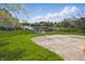 Landscaped backyard with green lawn and a pond at 3256 Waterside Ct, Greenwood, IN 46143