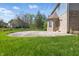 A well maintained backyard has a concrete patio and lush green grass at 3256 Waterside Ct, Greenwood, IN 46143