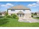 The backyard features an outdoor patio, a white door and windows, and a partial fence at 3256 Waterside Ct, Greenwood, IN 46143