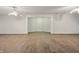 Finished basement area with tiled floor and white brick accent wall and alcove at 3256 Waterside Ct, Greenwood, IN 46143
