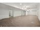 Spacious unfinished basement with tiled floor and freshly painted walls at 3256 Waterside Ct, Greenwood, IN 46143