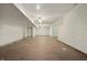Large unfinished basement with wood look tiled floors and white brick accent wall at 3256 Waterside Ct, Greenwood, IN 46143