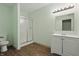 Small bathroom with green walls, shower, toilet, vanity and tiled floor at 3256 Waterside Ct, Greenwood, IN 46143