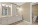Bright bathroom featuring double sinks and a door to the toilet for added convenience at 3256 Waterside Ct, Greenwood, IN 46143