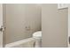 Toilet in half bathroom featuring light-colored walls and flooring at 3256 Waterside Ct, Greenwood, IN 46143
