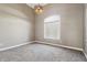 Neutral bedroom features large window, modern lighting, and carpet flooring at 3256 Waterside Ct, Greenwood, IN 46143