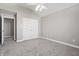 Large bedroom featuring plush carpeting, and a double-door closet for storage at 3256 Waterside Ct, Greenwood, IN 46143