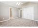 Spacious bedroom with neutral walls, plush carpet, ceiling fan and ensuite bathroom at 3256 Waterside Ct, Greenwood, IN 46143