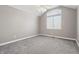 Bright bedroom featuring high ceilings, plush carpeting, and a large window at 3256 Waterside Ct, Greenwood, IN 46143