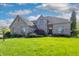 Charming brick home featuring manicured lawn, elegant landscaping, and traditional architectural design at 3256 Waterside Ct, Greenwood, IN 46143