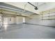 Spacious garage with grey painted floor and white storage shelves at 3256 Waterside Ct, Greenwood, IN 46143
