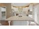Updated kitchen features stainless steel appliances, island, and white cabinets at 3256 Waterside Ct, Greenwood, IN 46143