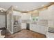 Bright kitchen featuring white cabinetry, stainless steel appliances, and granite countertops at 3256 Waterside Ct, Greenwood, IN 46143