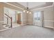 Open-concept living room featuring large windows, neutral walls, and a staircase at 3256 Waterside Ct, Greenwood, IN 46143