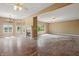 Spacious living room showcases fireplace, multiple windows, and easy access to other living areas at 3256 Waterside Ct, Greenwood, IN 46143