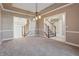 Spacious living room with staircase and open doorway to adjoining rooms at 3256 Waterside Ct, Greenwood, IN 46143