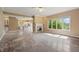 Open-concept living room offers abundant natural light, fireplace, and view to the kitchen at 3256 Waterside Ct, Greenwood, IN 46143