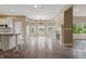 View of living space and kitchen featuring large windows for natural light at 3256 Waterside Ct, Greenwood, IN 46143