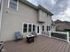 Backyard deck with chairs, fire pit, and hot tub, perfect for entertaining at 3806 Sycamore Bend S Way, Columbus, IN 47203