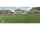 Large backyard with a deck and hot tub, perfect for outdoor enjoyment at 3806 Sycamore Bend S Way, Columbus, IN 47203