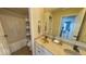Bathroom with double sinks, large mirror, and shower-tub combo at 3806 Sycamore Bend S Way, Columbus, IN 47203