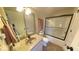 Well-lit bathroom featuring a glass shower door and neutral color palette at 3806 Sycamore Bend S Way, Columbus, IN 47203