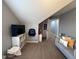Spacious bedroom with a gray sofa and an oversized TV at 3806 Sycamore Bend S Way, Columbus, IN 47203