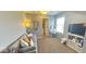 Comfortable bedroom with a cozy seating area, desk, and natural light at 3806 Sycamore Bend S Way, Columbus, IN 47203
