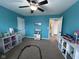 Playful bedroom featuring colorful decor, a ceiling fan, and ample space for activities at 3806 Sycamore Bend S Way, Columbus, IN 47203