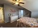 Bedroom featuring sloped ceilings, a ceiling fan, and neutral decor at 3806 Sycamore Bend S Way, Columbus, IN 47203