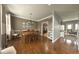 Inviting dining room with hardwood floors and a large wooden table at 3806 Sycamore Bend S Way, Columbus, IN 47203