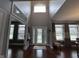Bright foyer with soaring ceilings, stained-glass front door, and hardwood floors at 3806 Sycamore Bend S Way, Columbus, IN 47203