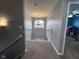 Bright hallway featuring a statement chandelier and ample natural light at 3806 Sycamore Bend S Way, Columbus, IN 47203