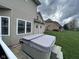 Outdoor hot tub on the deck, set on a stone platform, perfect for relaxation at 3806 Sycamore Bend S Way, Columbus, IN 47203